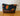 Pochette La trousse Kazak Fleurs oranges / brun